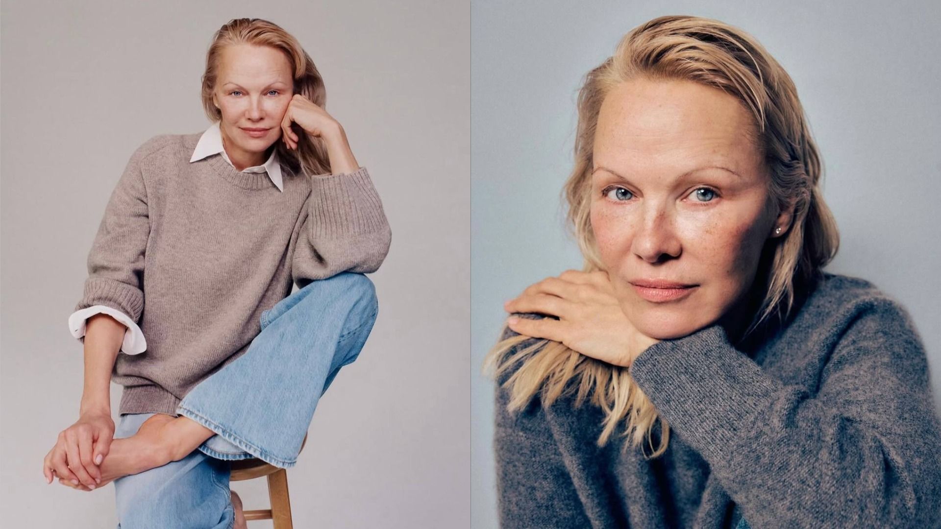 La actriz Pamela Anderson en un suéter beige y camisa blanca sentada en una silla, sosteniendo su pierna con la mano y mirando a la cámara